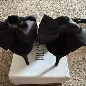Black suede heels with a bow
